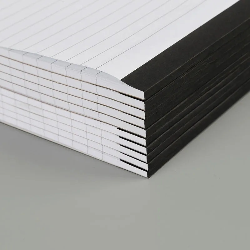 A4 tearable notebook with grid-lined pages and wireless adhesive binding in paper cover