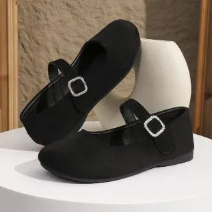 Black canvas men's fisherman shoes with a flat rubber sole, shown from the side.