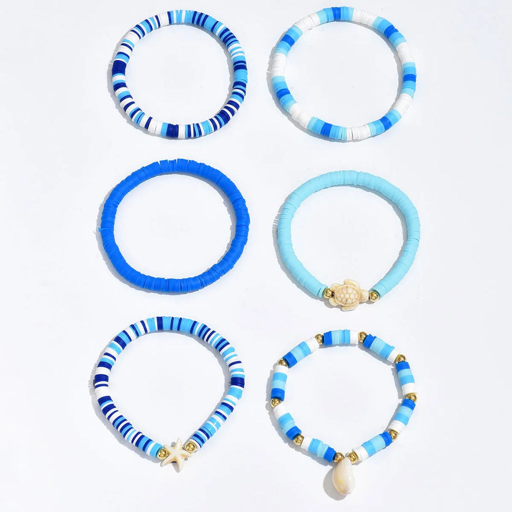 Six polymer clay handmade bracelets with Bohemian blue shells and geometric designs
