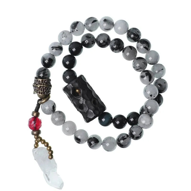 Ethnic black hair bracelet with white crystal tassel featuring bend and lace craftsmanship