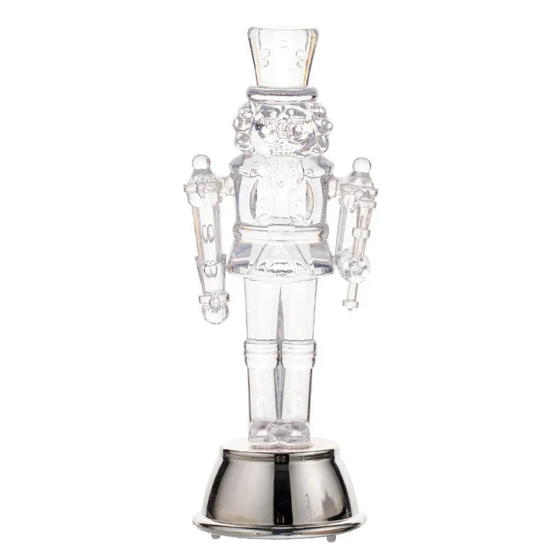 Transparent plastic walnut soldier Christmas ornament nutcracker decoration on desktop.