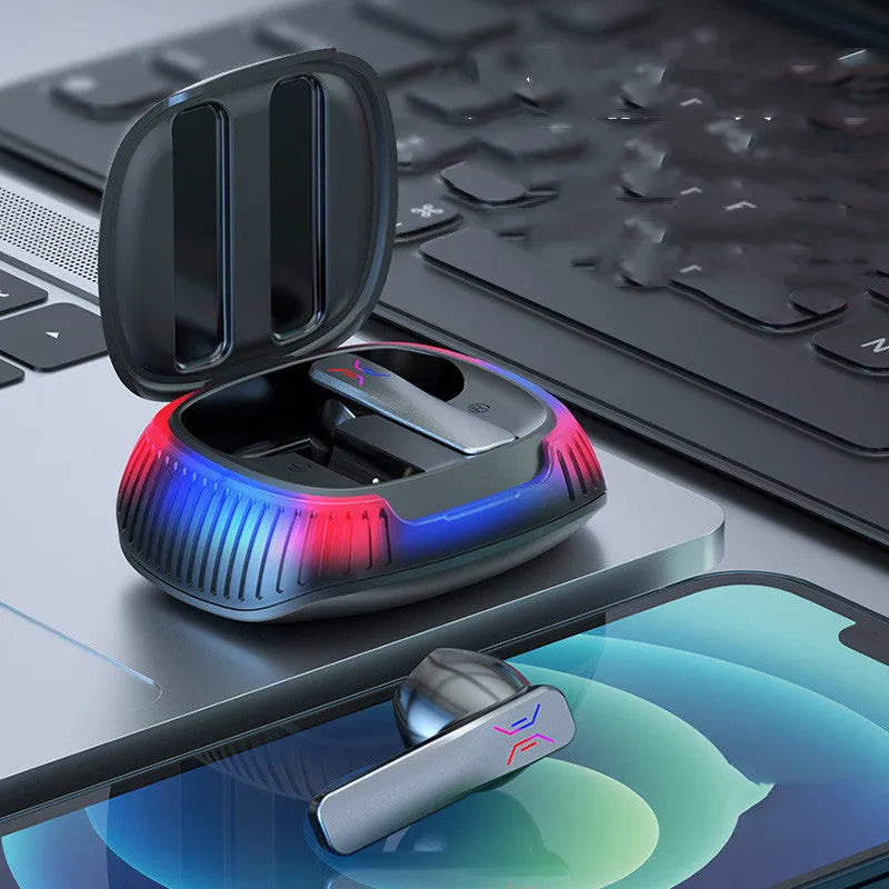 Hall Flashing black wireless gaming earbud with a Type-C cable on a dark surface.