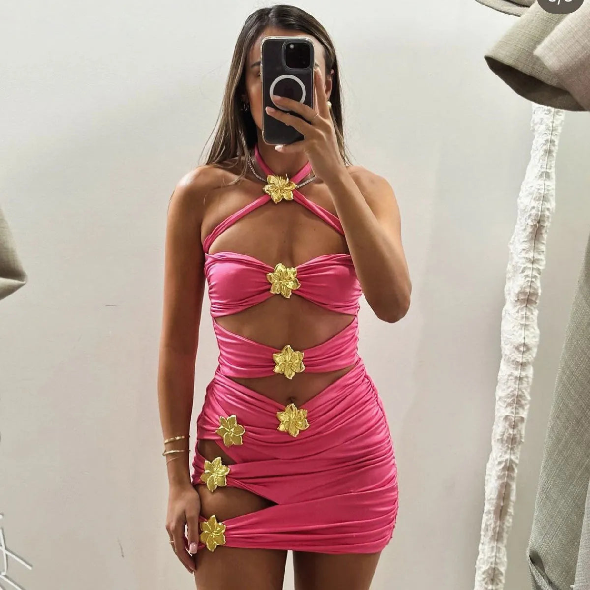 Women's solid colour one-piece swimsuit with attached short skirt and hollow-out tube top design