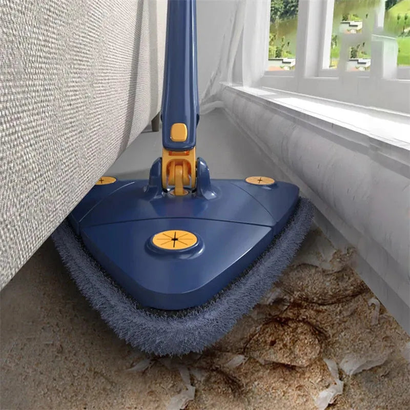 Blue triangular cleaning mop with a 360-degree rotating head and extended stainless steel pole on a tile floor.