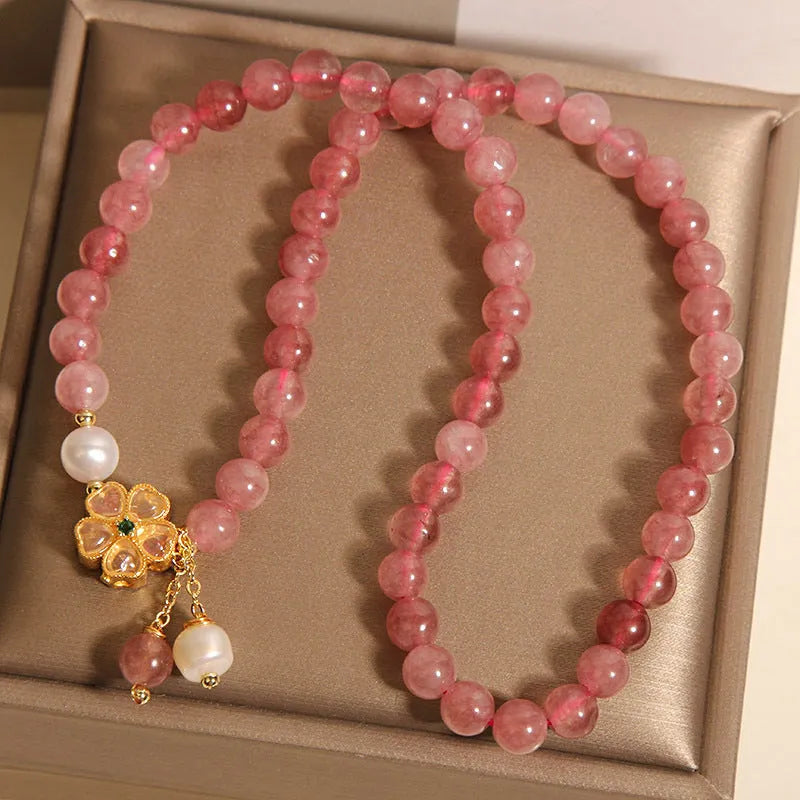 Women's double ring bracelet with strawberry quartz four-leaf clover design in Japanese Korean jewellery style