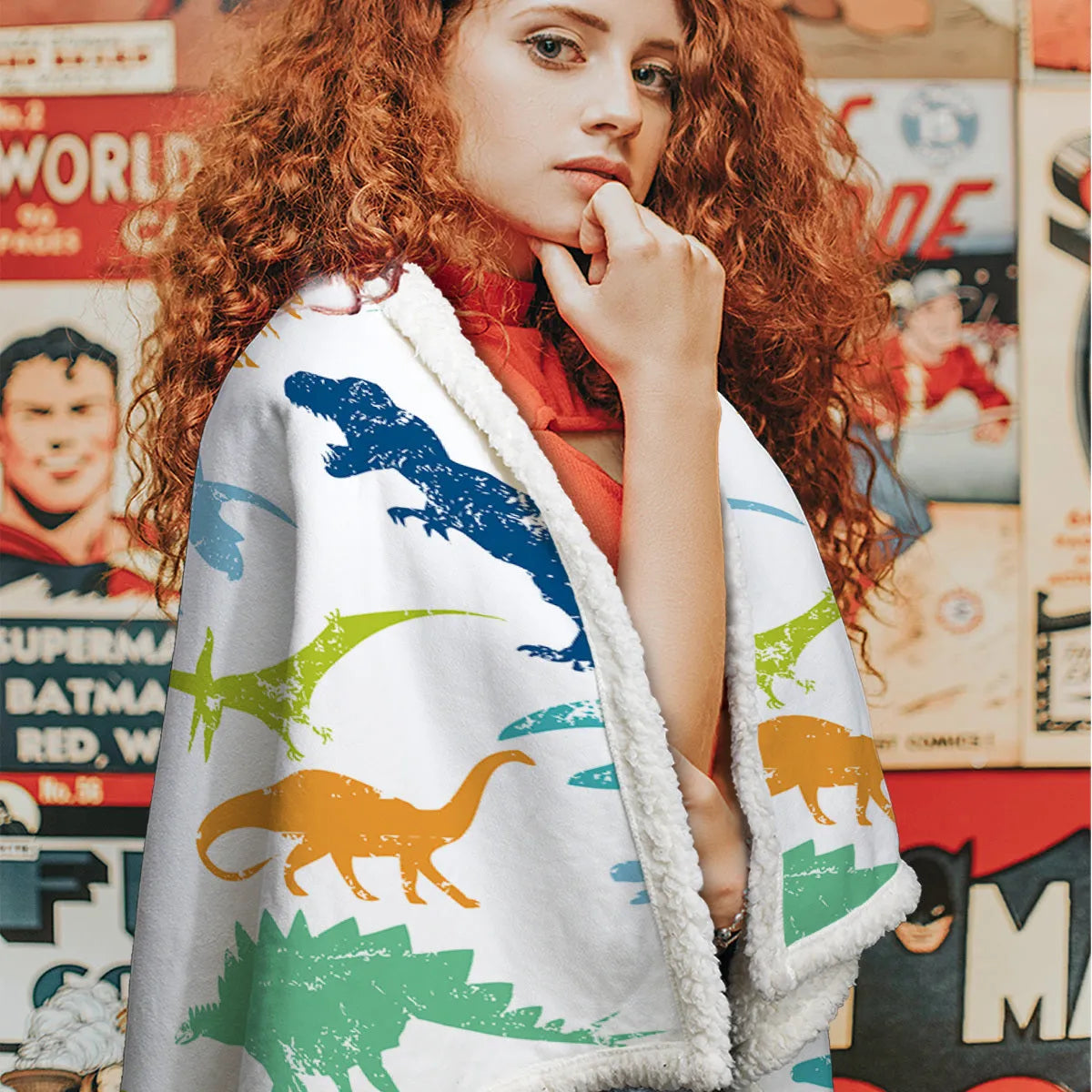 Dinosaur themed lamb wool blanket in white on a sofa, measuring 130x150cm or 150x200cm