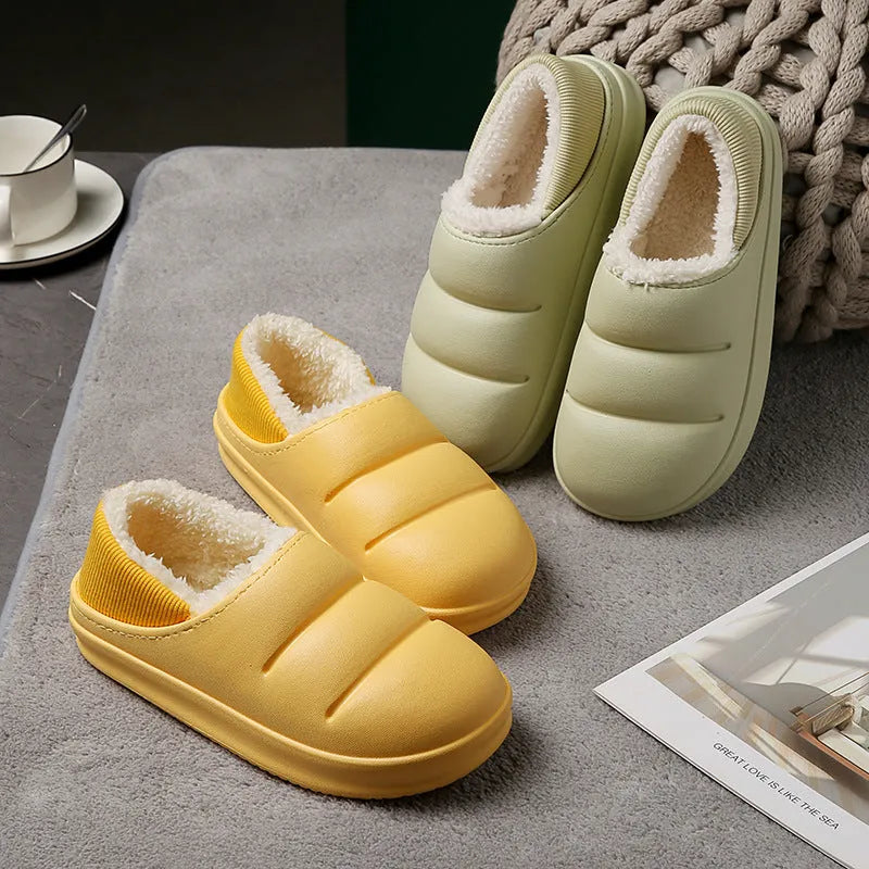 A pair of waterproof EVA couple slippers in green with a plush lining and non-slip sole.