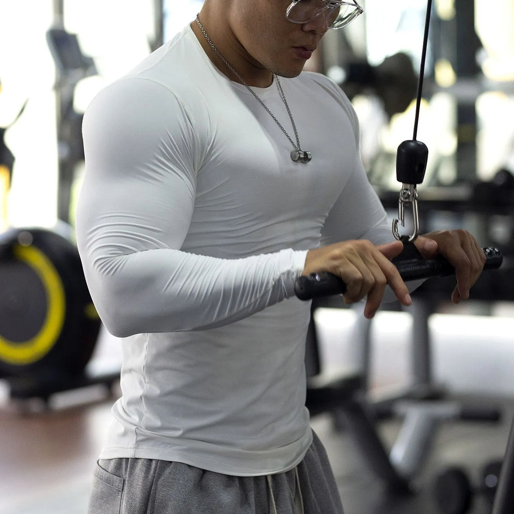 Men's black fitness tights with long sleeves slim fit design for athletic activities