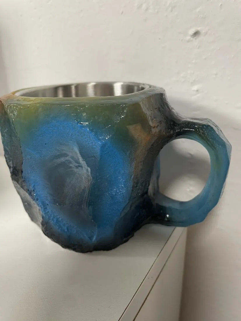 Purple resin mineral crystal coffee mug with handle showing 3D texture and 10cm height