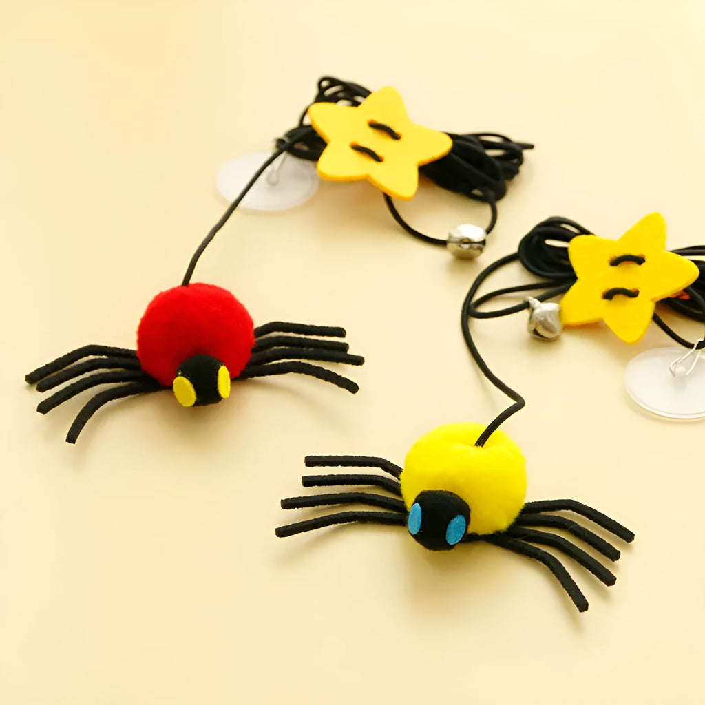 Red or yellow elastic rope cat toy with feather stick and fabric spider bell hanging from a door