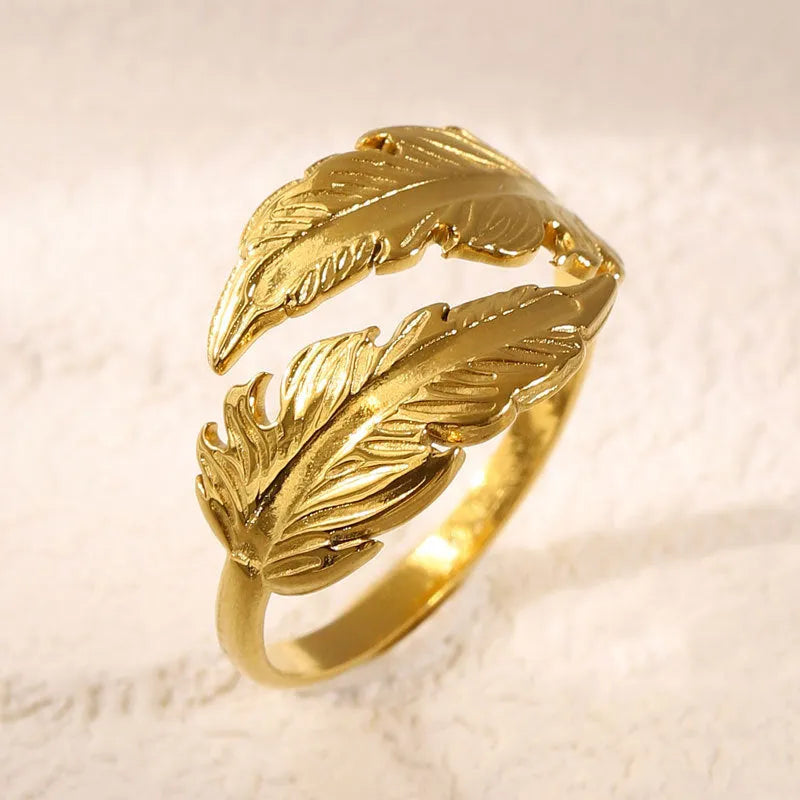 Women's adjustable stainless steel feather ring in gold and silver colour options